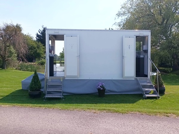 Toilet trailer with front and back doors