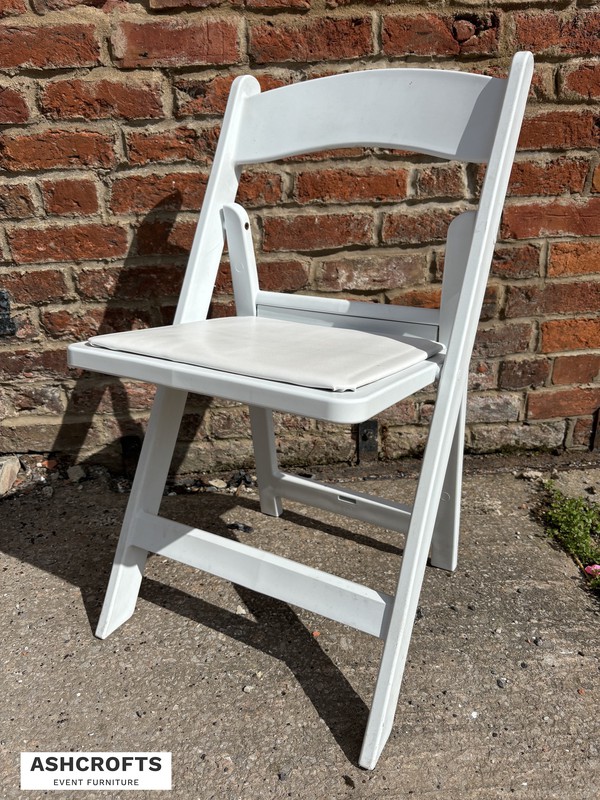 White folding ceremony chairs