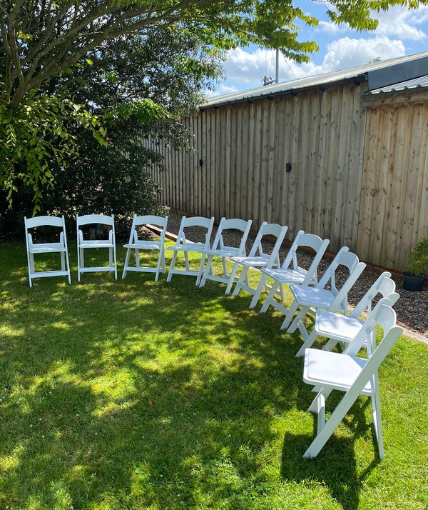 White folding wedding chairs