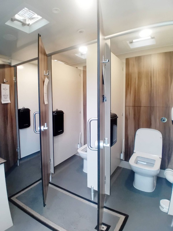 Toilet trailer with modern wooden trim