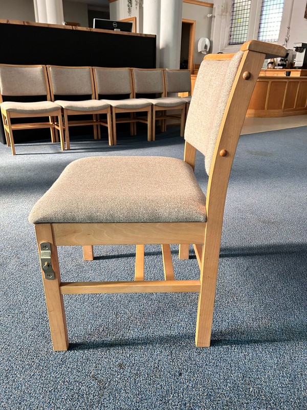 Comfortable upholstered church chairs with wooden frames