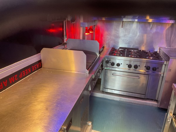 Catering van with six burner cooker