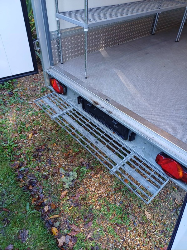 Fridge trailer with rear step