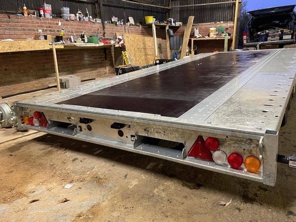 Trailer with ramp storage