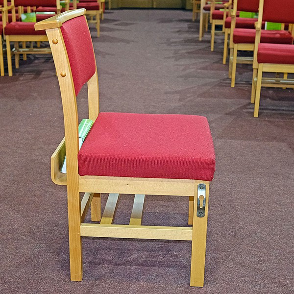 Red Church Chairs with shelf under for kneelers, and a Bible rack