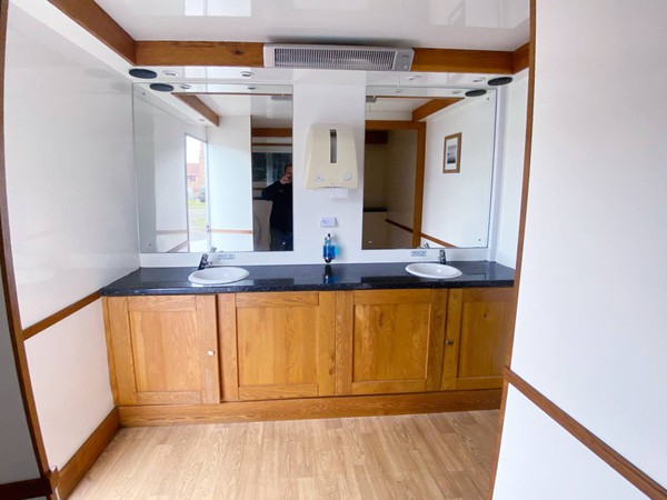 Gents side with wooden vanity units