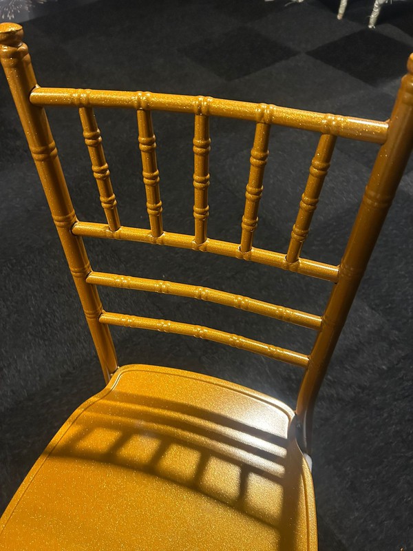 Plastic stacking chairs in Gold