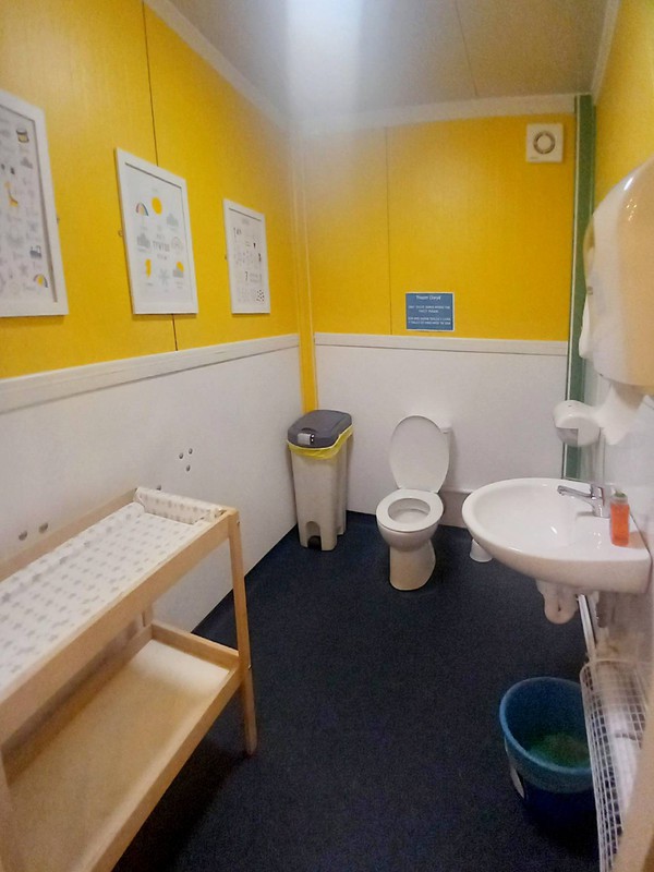 Toilet cubicle with baby changing