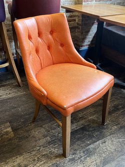 orange plush faux leather dining chairs