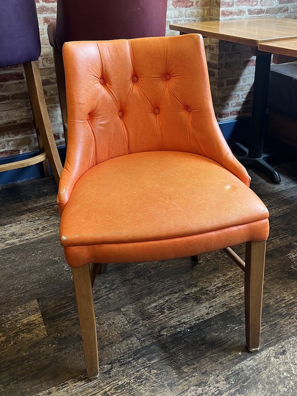 orange faux leather dining chairs