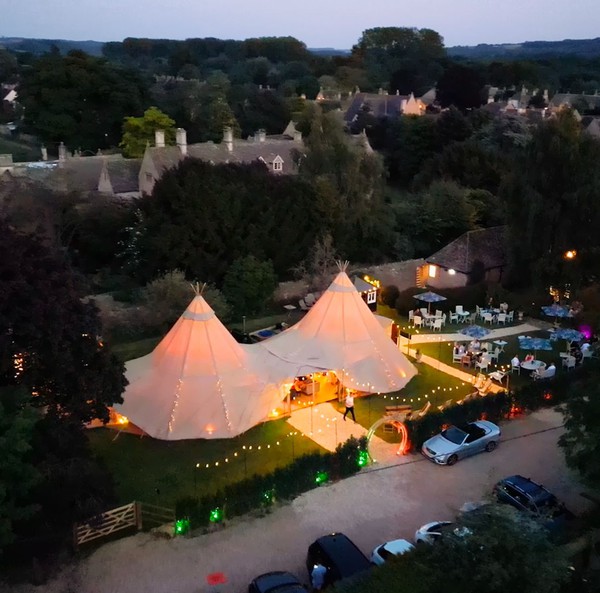 Two tipis for sale at night