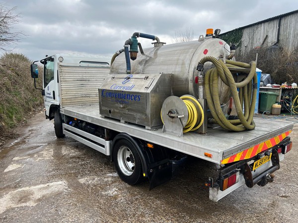 Toilet service truck with tow bar