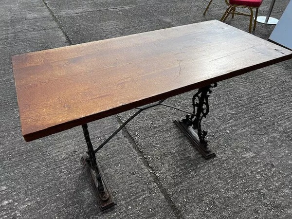 Solid wood table with cast iron legs