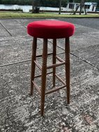 High bar stool with red upholstery