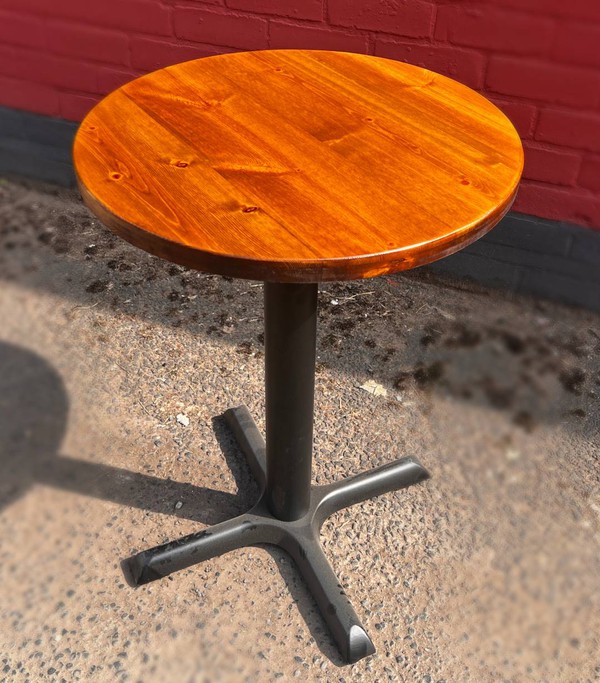 Wooden pub table with cast iron base