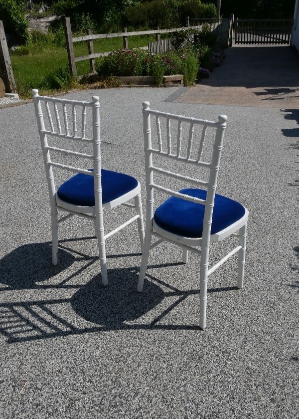 Secondhand White Wooden Chiavari Chairs and Blue Velvet Seat Pads For Sale