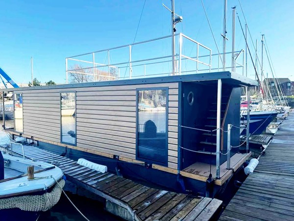 Floating home with roof deck