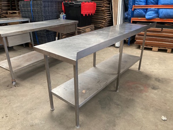 Stainless steel table with upstand