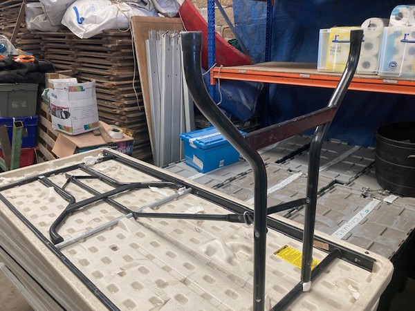 Trestle table with folding legs
