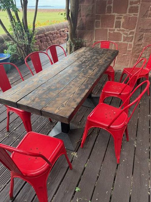Rustic wooden tables and red Tolix chairs for sale Rustic wooden tables and red Tolix chairs for sale