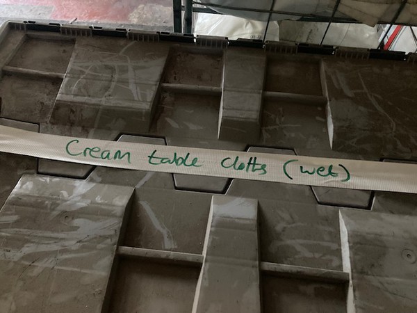 Box of cream table cloths