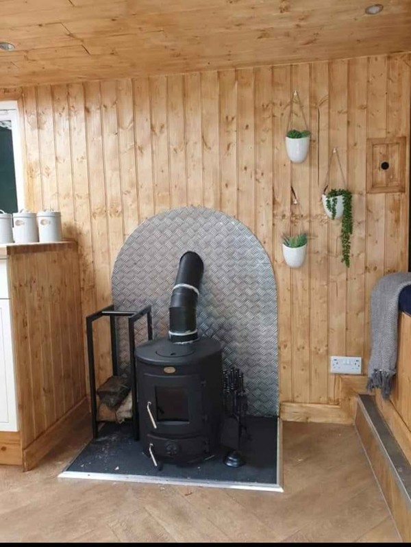 Glamping pod with wood burning stove