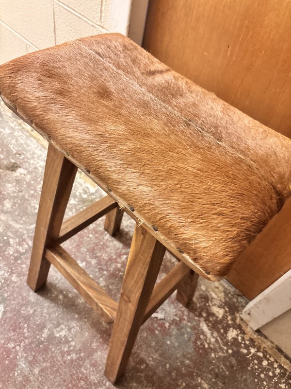 Rustic cow hide stool