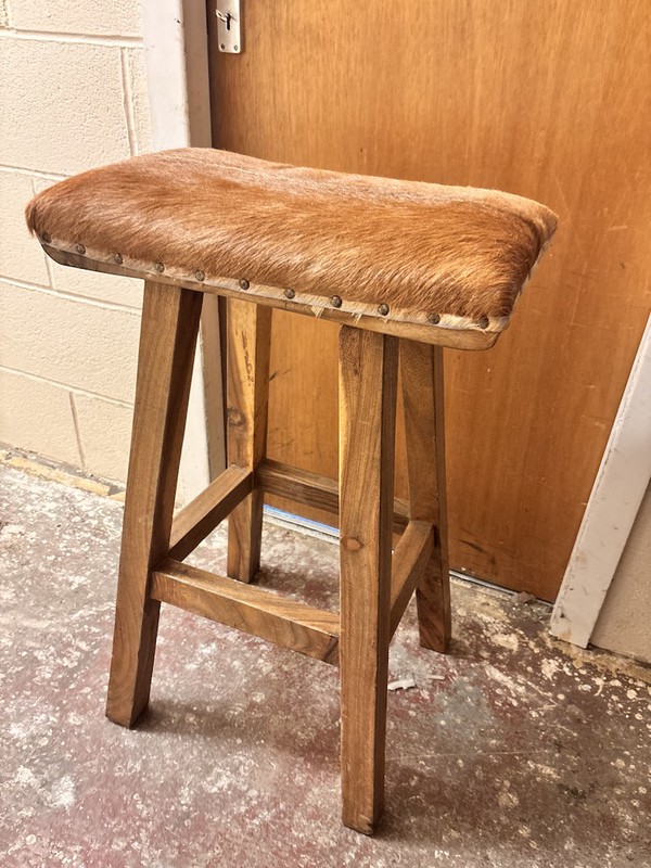 pair of cow hide stools