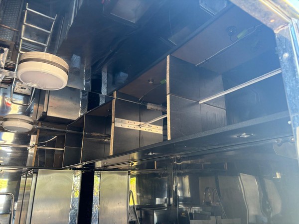 Catering trailer with stainless steel cupboards