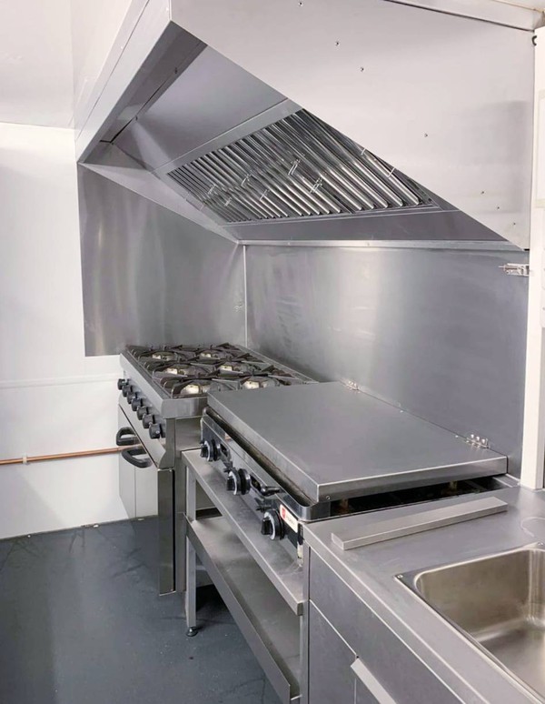 Six burner range cooker with extraction hood