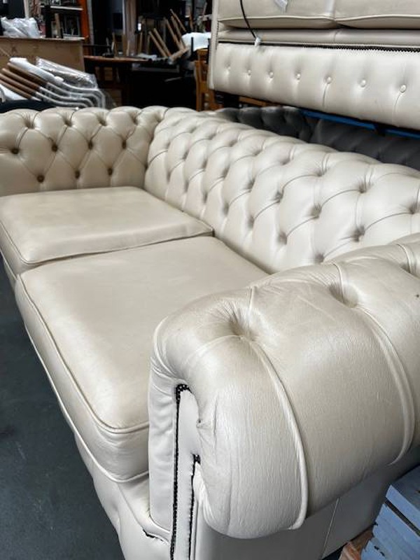 Grey button back sofa